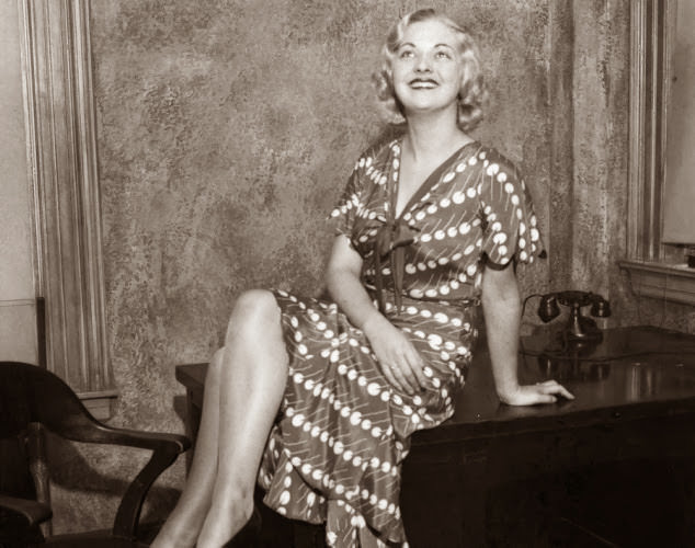 Well-known fashion model Sandy Goodwin, who posed for the entrance plaques at Radio City, hams it up for photographers in 1932.