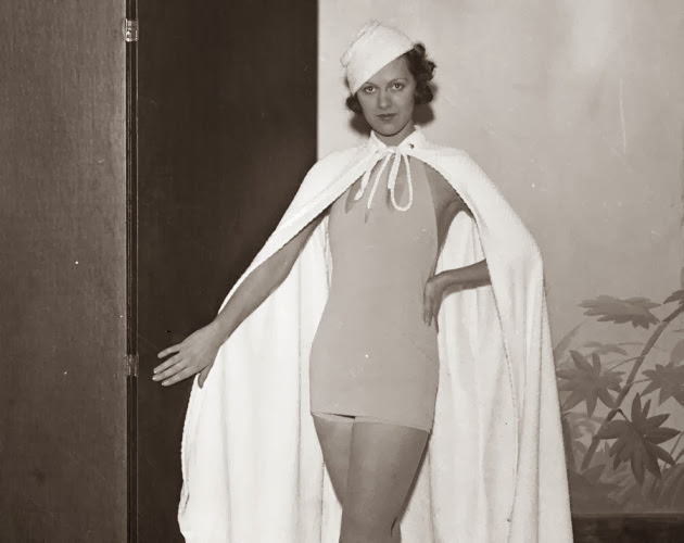 This supermodel looks like Superwoman! Ruth Dodd models a Nantucket one-piece with a detachable skirt at a bathing suit show in 1933.