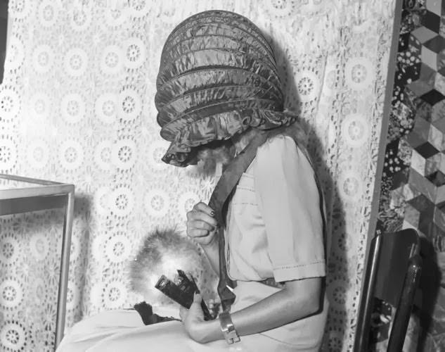 We thought models liked to show off their beautiful faces, but apparently in 1941 the folding bonnet was all the rage.