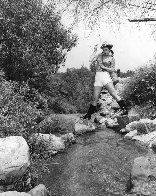 Pat Alphin, a film actress catches a fish, 1935.