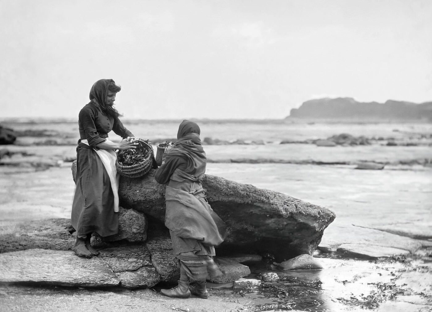 Two fish wives with basket at Whitby.