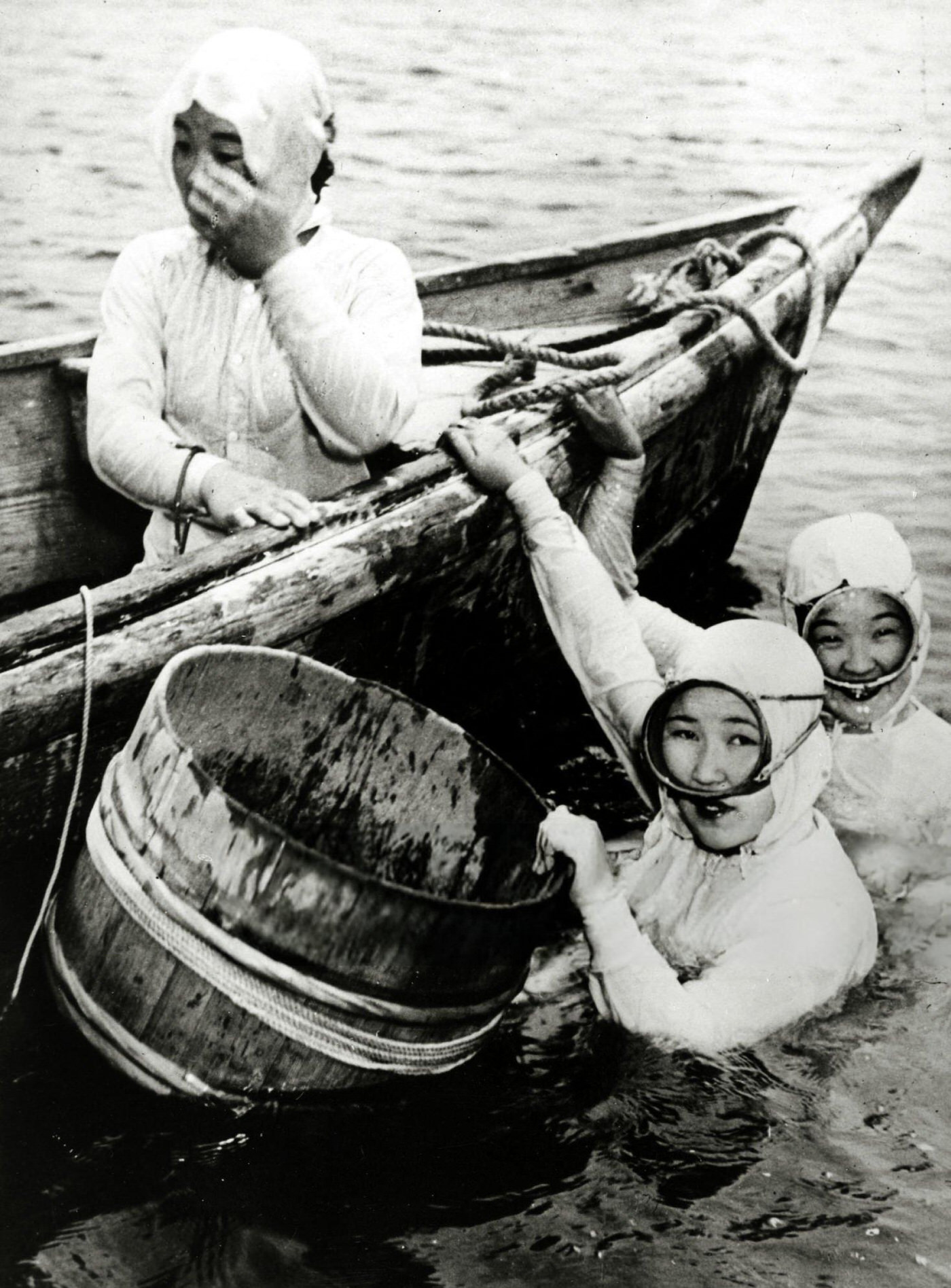 Japanese girl divers collecting oysters from the sea and river estuaries, 1950.
