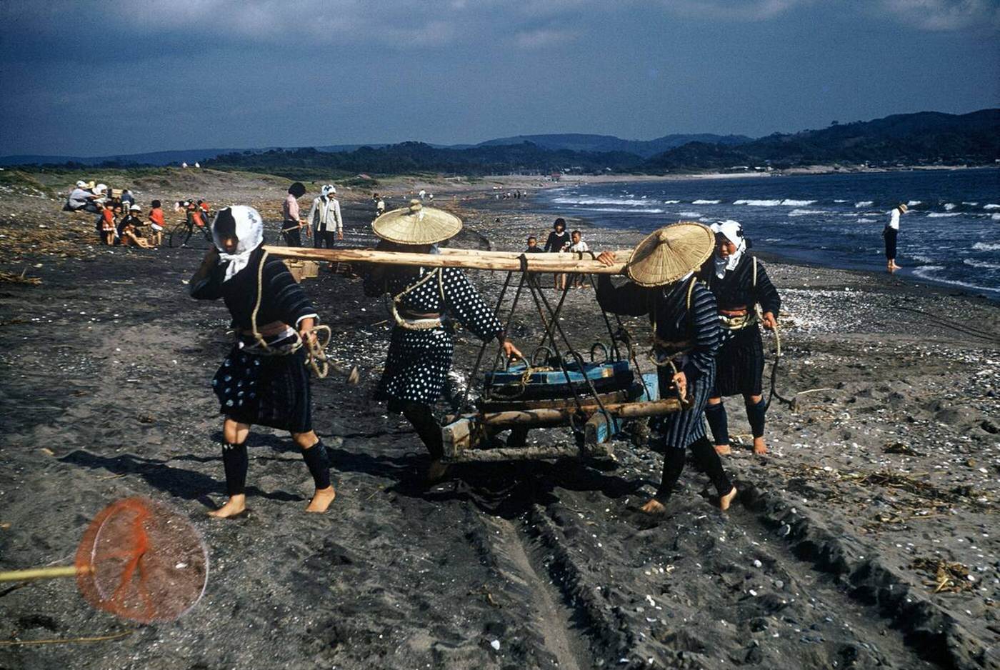 Japanese fisherwomen at work on the beach in Honmoku in Yokohama, Kanagawa Prefecture, 1950s.