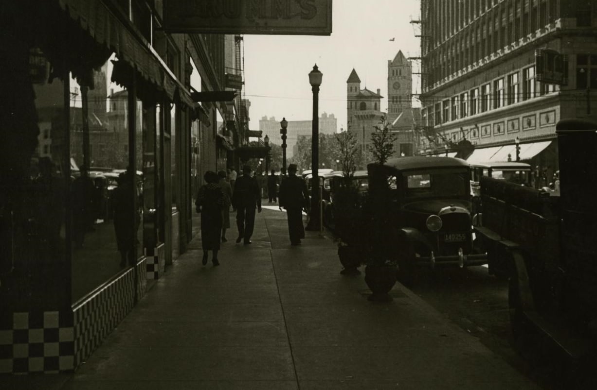 Pedestrians on a sidewalk in Fort Worth, Texas, 1930s.