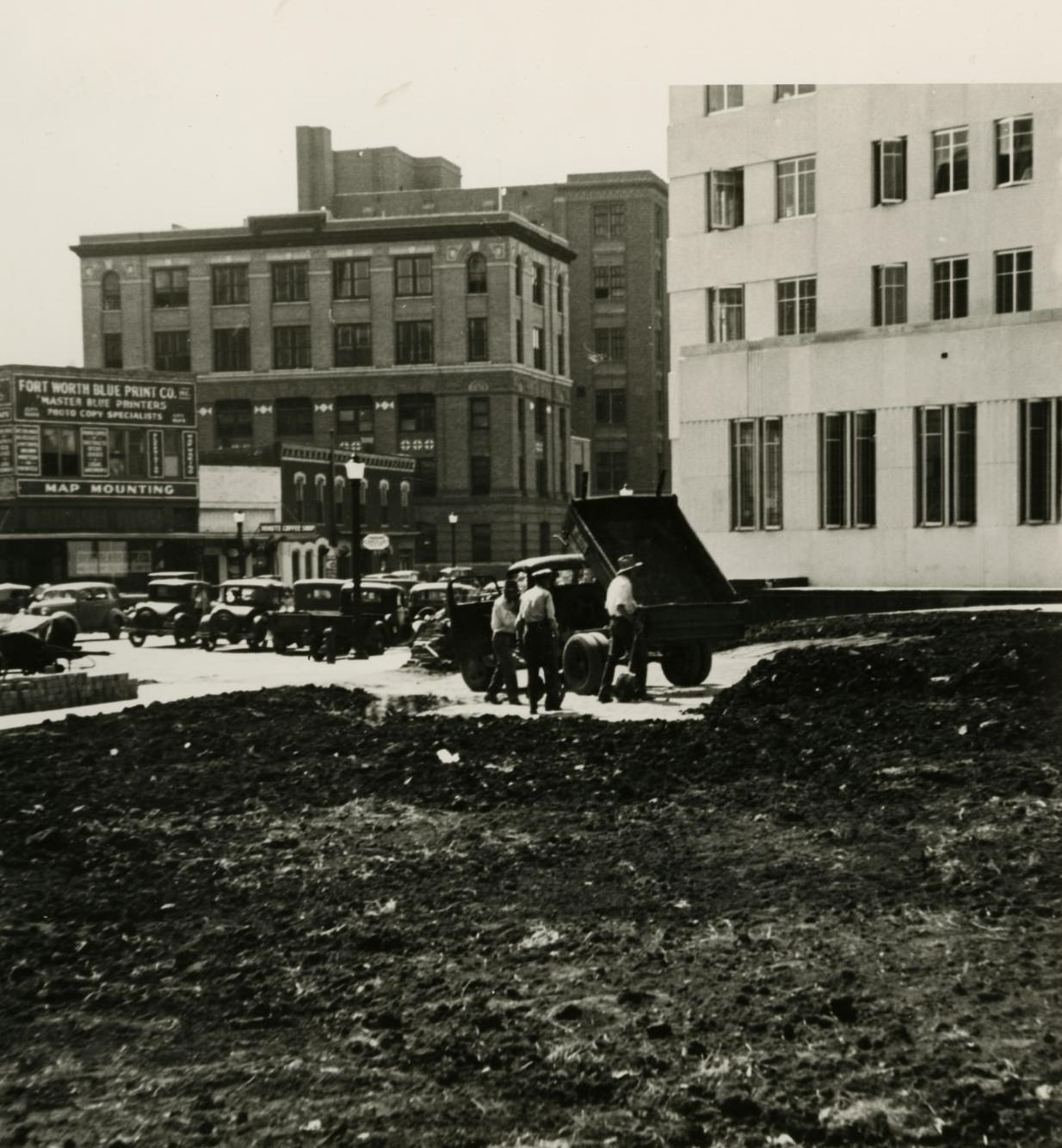 Construction workers on a site across from the Fort Worth Blue Print Co., 1930s.