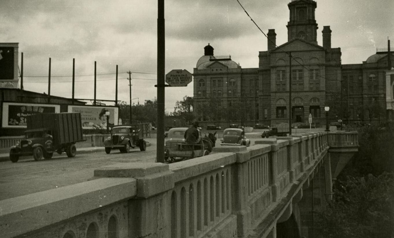 The Tarrant County courthouse and Main Street, Fort Worth, Texas, 1930s-1940s.