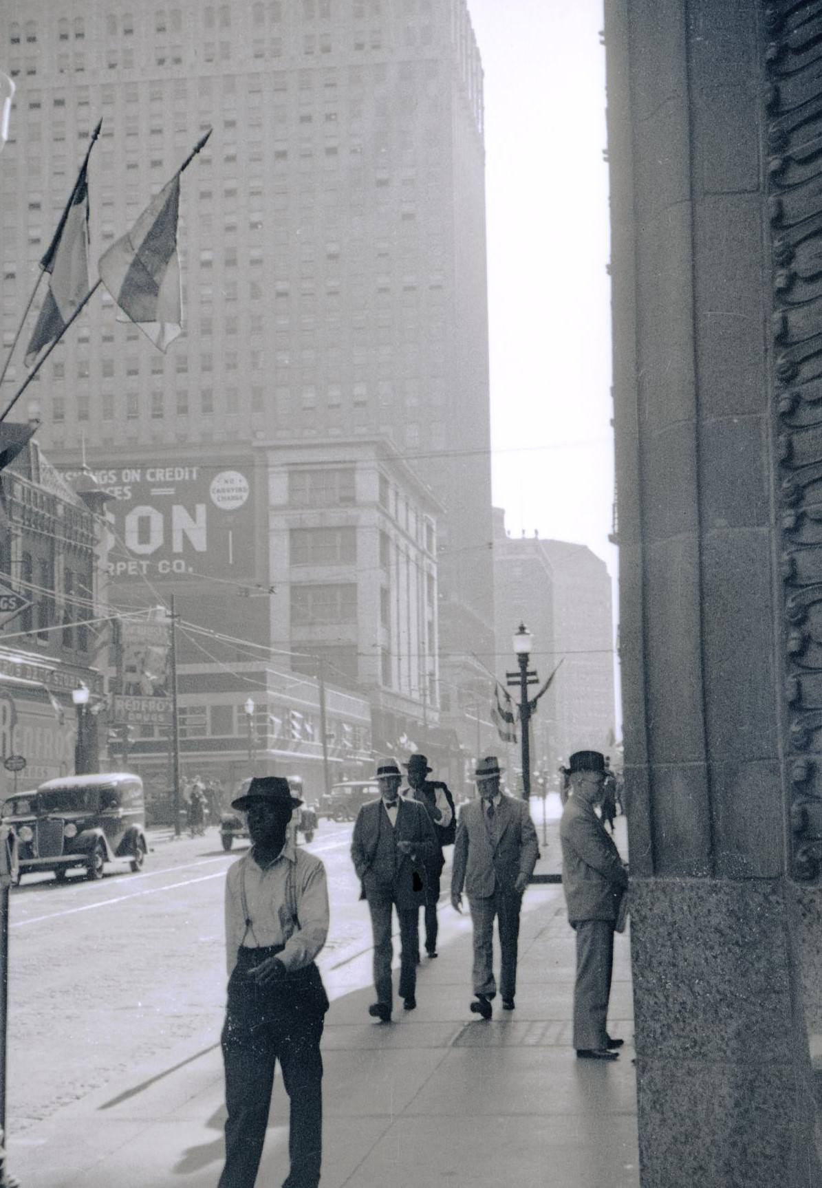 Men walking on the sidewalk at 7th & Main in Fort Worth, Texas, 1936.