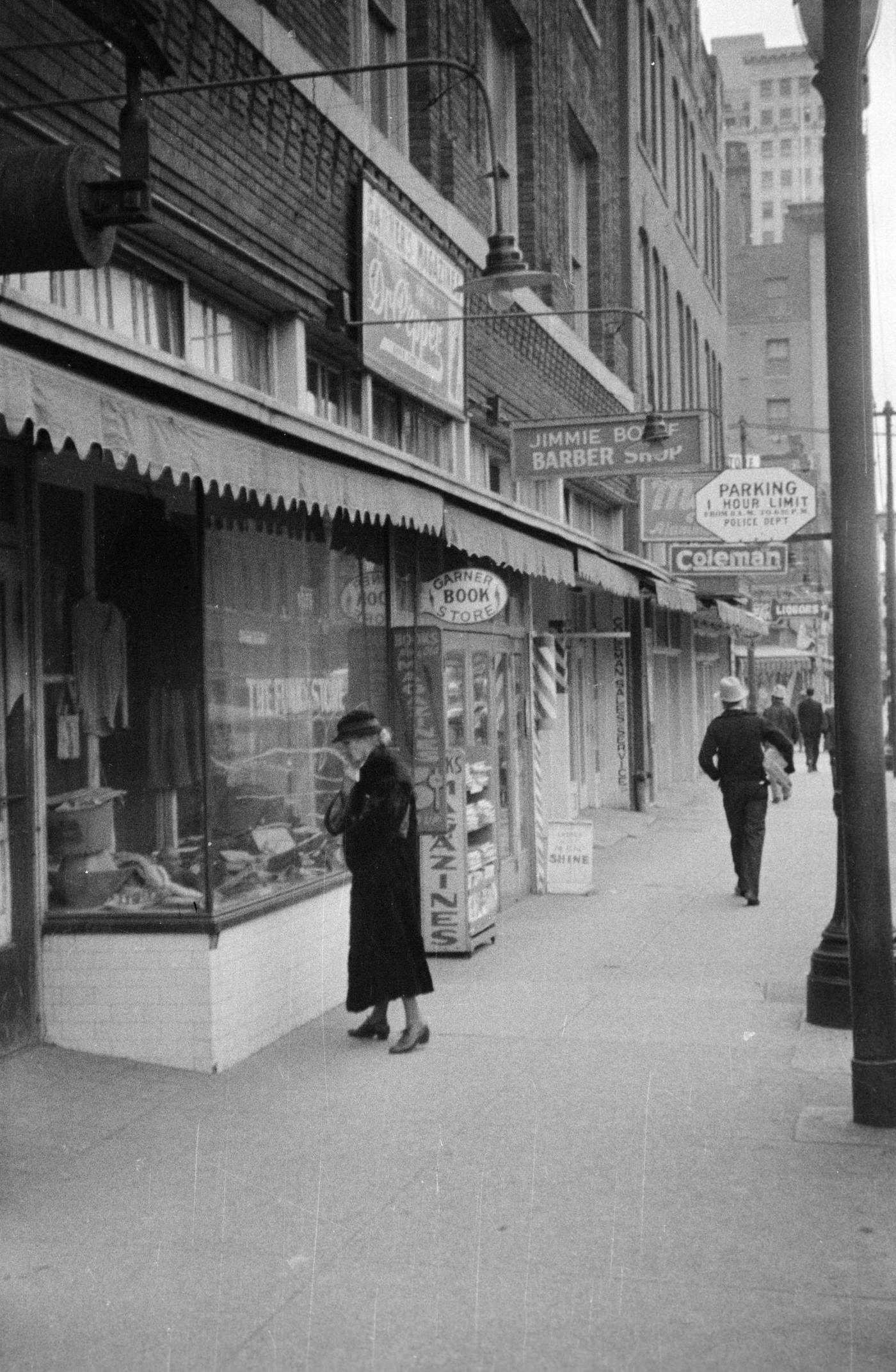 Pedestrians on a sidewalk in downtown Fort Worth, Texas, 1930s.
