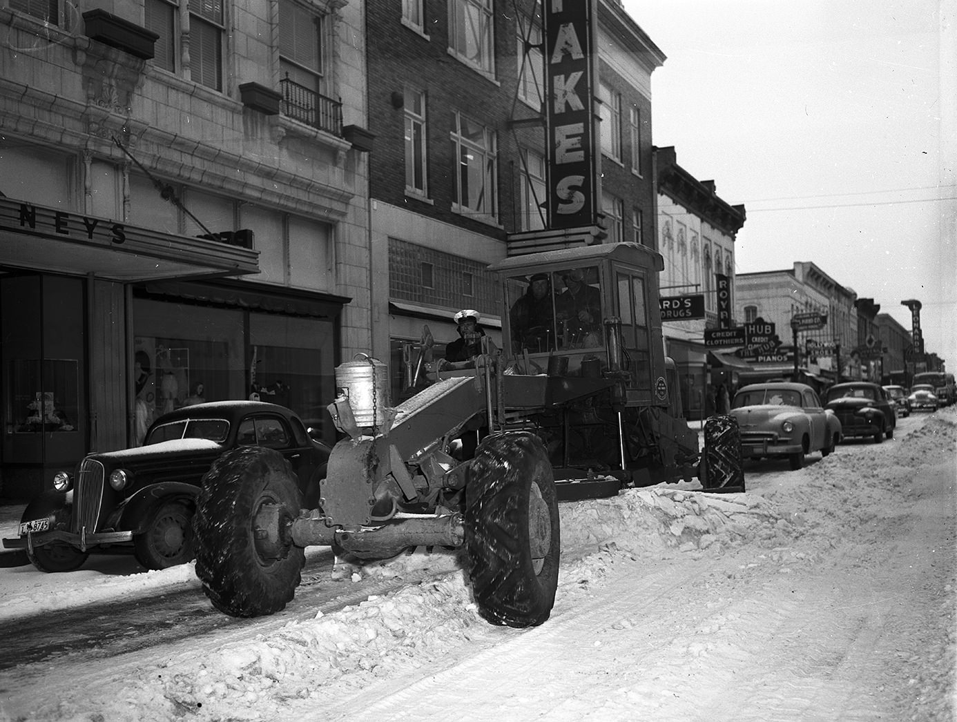 City snow plow on Houston Street, clearing sleet and snow, 1951.