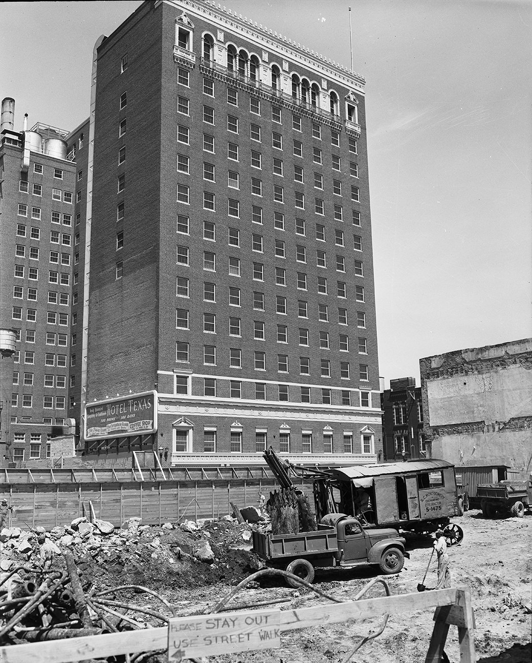 Excavators are digging foundations for new Fort Worth National Bank Skyscraper, across Main St. from Hotel Texas, 1950.