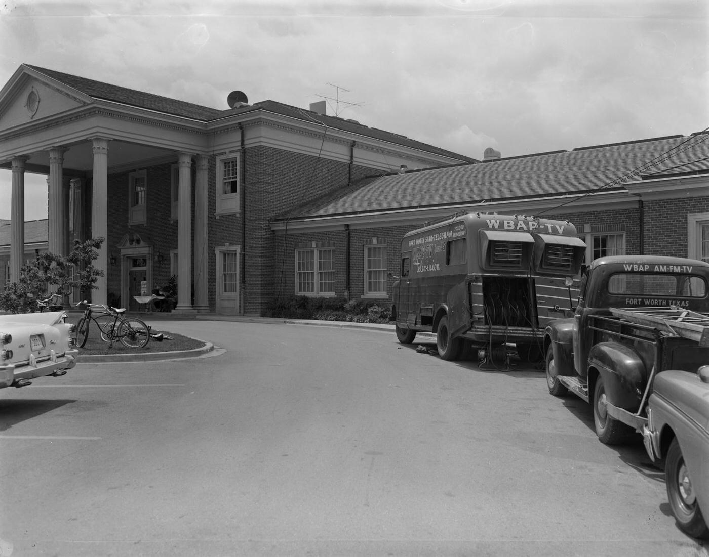 Colonial Country Club in Fort Worth, with WBAP vehicles, 1959.