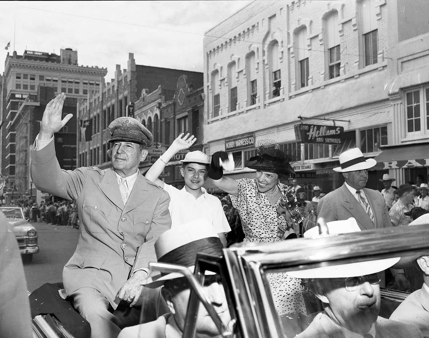 General Douglas MacArthur and his family greet spectators of the parade in Downtown Fort Worth, 1951.