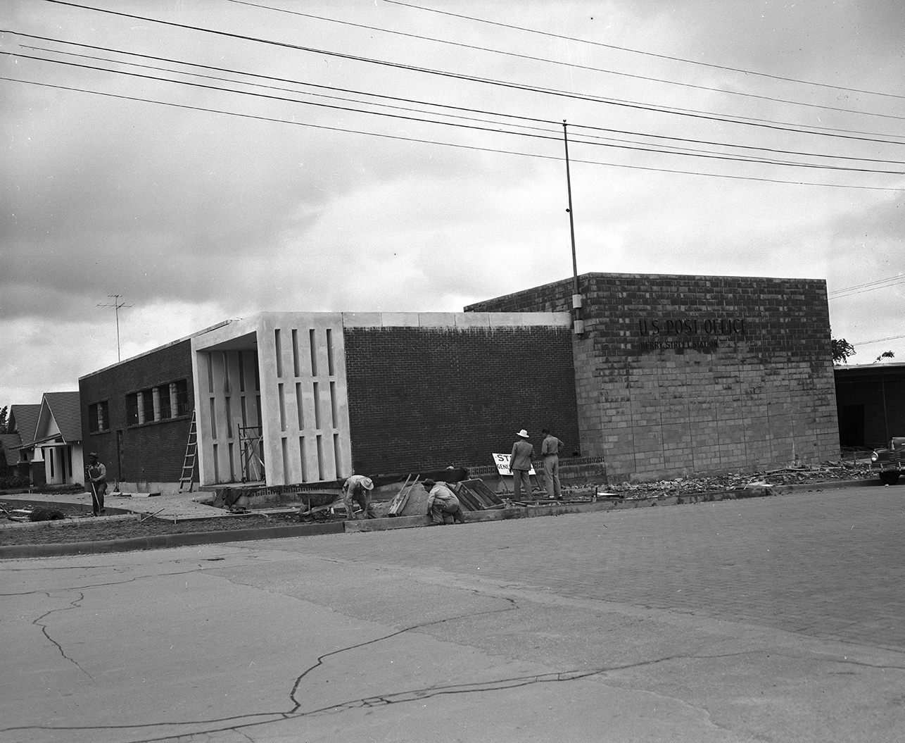 Workmen putting finishing touches on the Berry Street Station, U. S. Post-office Department, 1950.