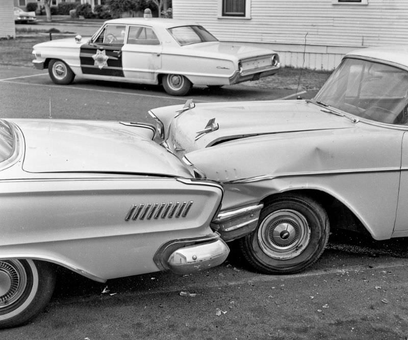 Parking lot collision, 1962 Chrysler New Yorker vs 1957 Chevrolet, at the Gateway Market on the north side of West Belmont Avenue in Fresno, California, March 21, 1964