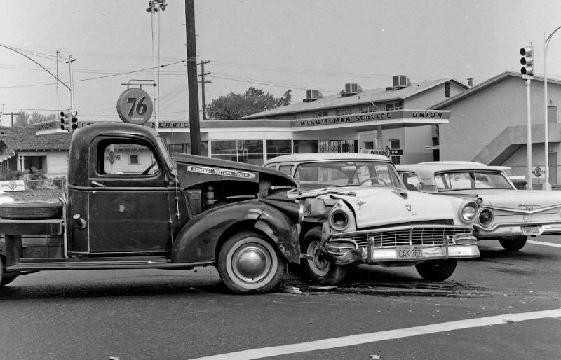 An old GMC flatbed truck versus a 1956 Ford Fairlane 4-door sedan in Fresno, California, October 28th, 1961