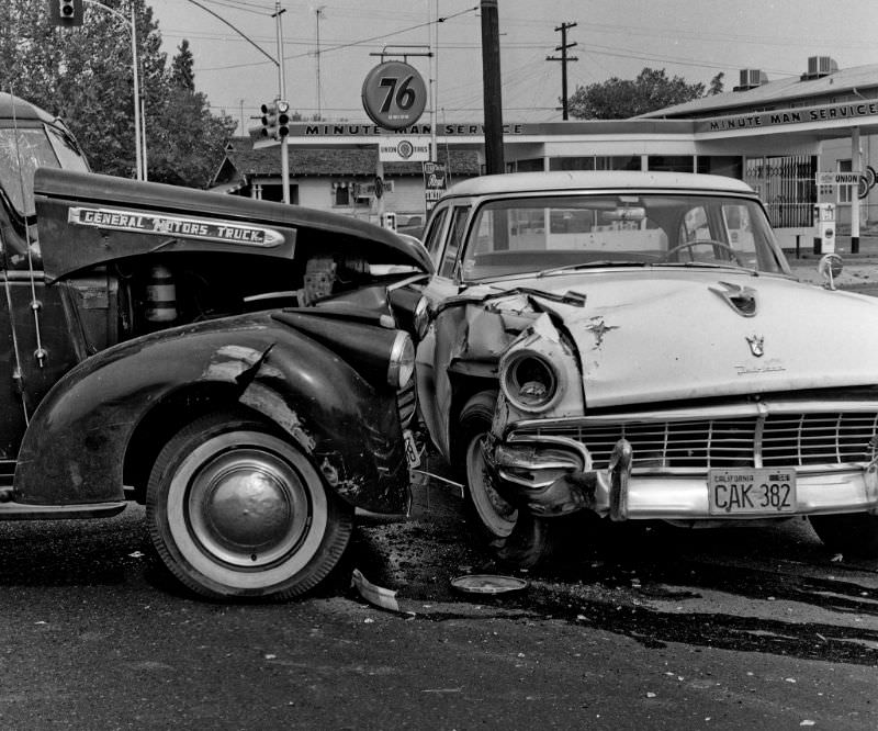 An old GMC flatbed truck versus a 1956 Ford Fairlane 4-door sedan in Fresno, California, October 28th, 1961