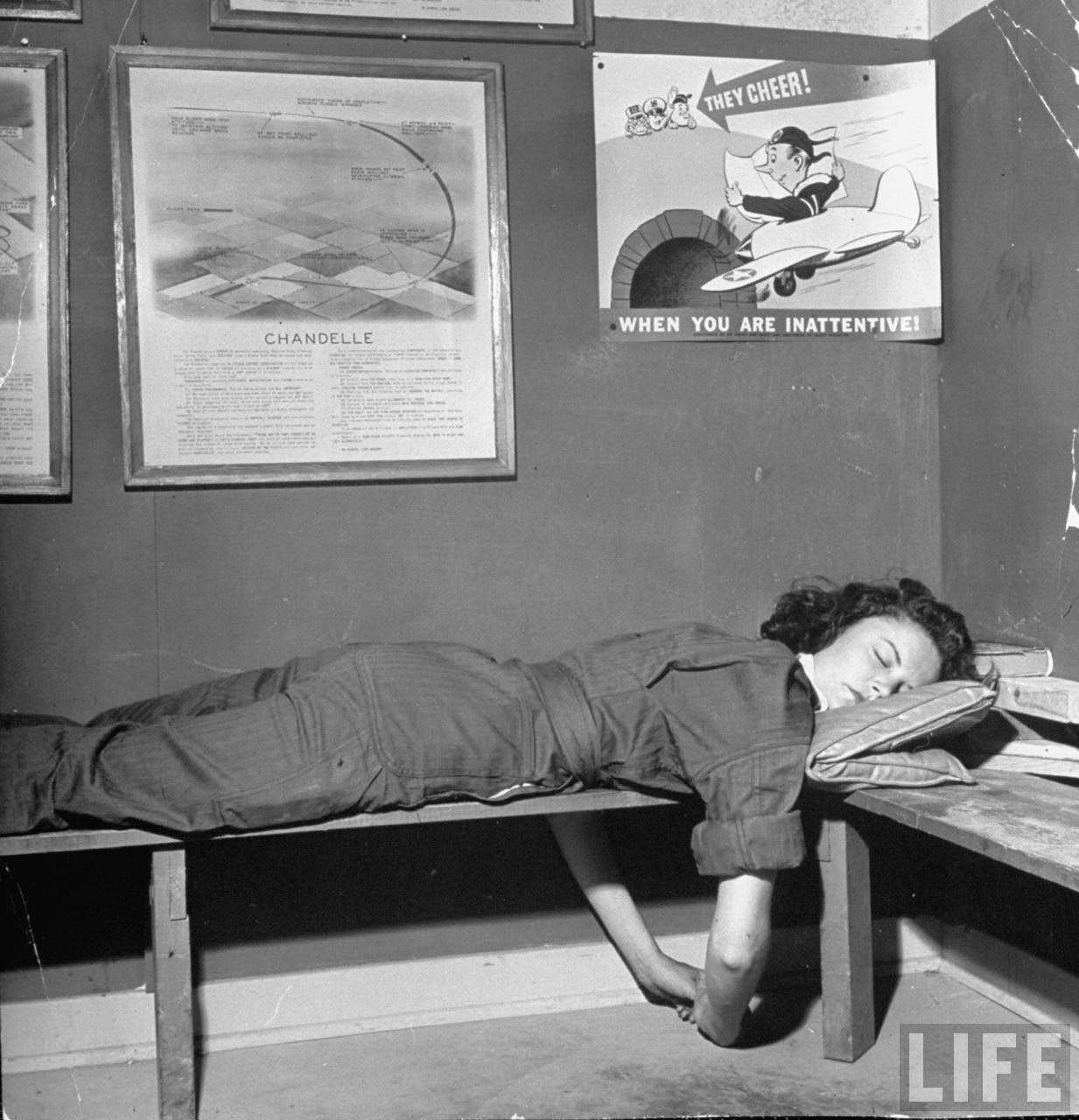 Elaine Jones, pilot trainee in the Women's Flying Training Detachment, sleeping on hard bench after flying until 3 a.m. the previous night, at Avenger Field.