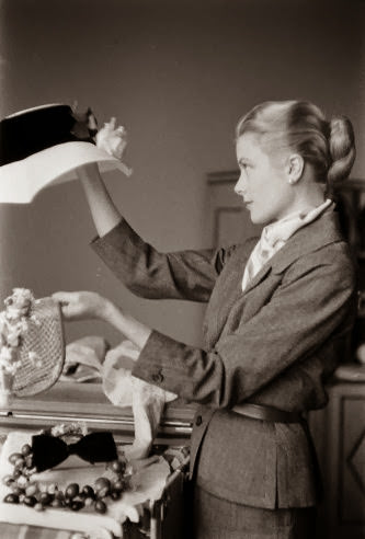 Grace Kelly packing for her trip to Monaco, March 1956