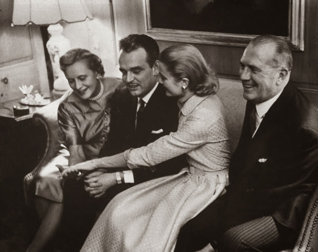 Grace Kelly and Prince Rainier show her engagement ring to her mother and father at the Kelly home in Philadelphia, 1956