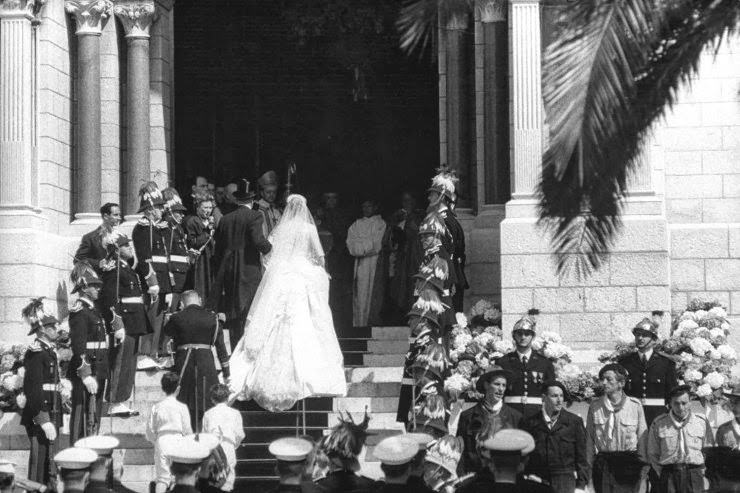 Prince Rainier III and Grace Kelly ascend the steps of Monaco Palace