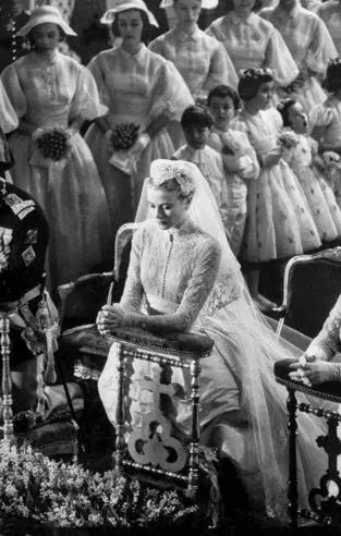 Grace Kelly prays before her wedding to Prince Rainier III, April 1956