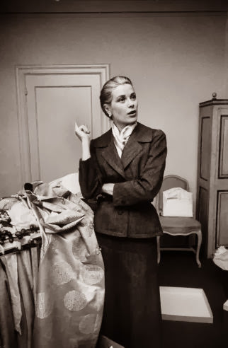 Grace Kelly takes a momentary breather while packing her things before the wedding, 1956