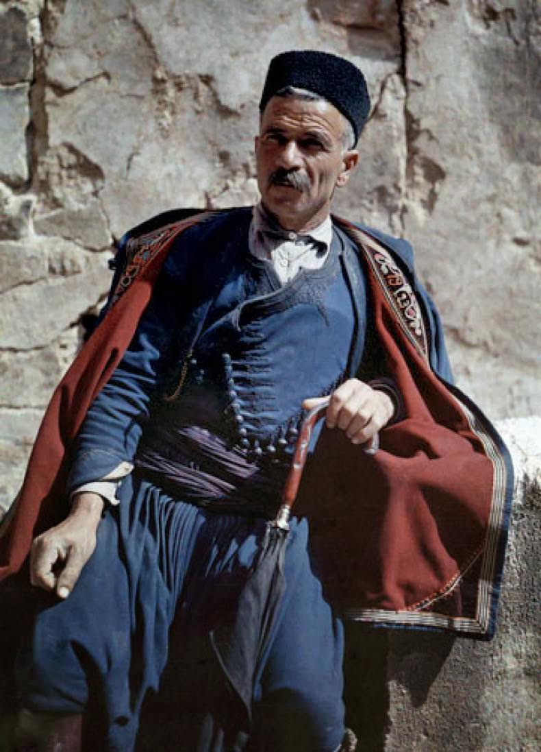A man poses in the national costume of Crete.