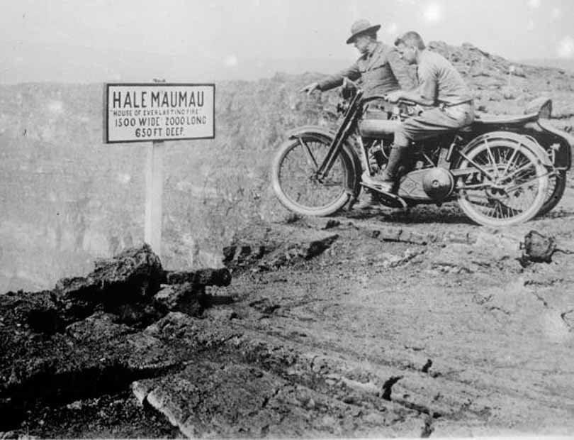 Tourists peer into the mouth of Halemaumau or 'House of Everlasting Fire,' the inner crater of Kilauea, 1930.