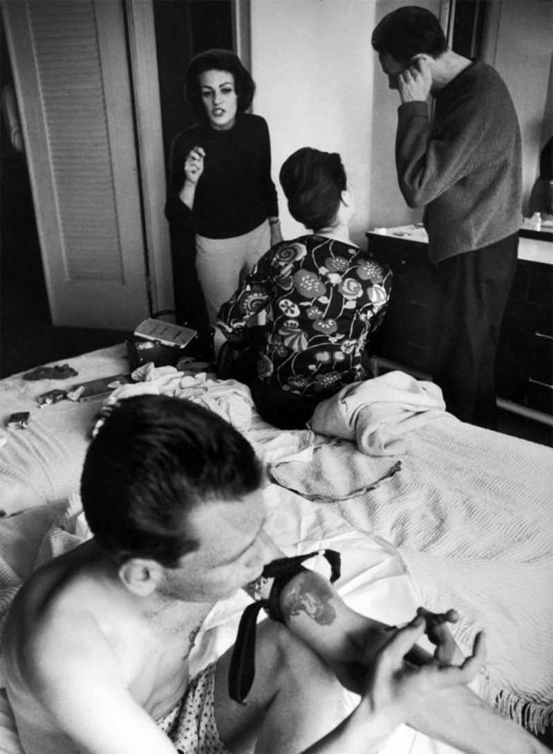 Heroin addicts shooting up in hotel room. John (fore) taking a shot within minutes of his release from jail.
