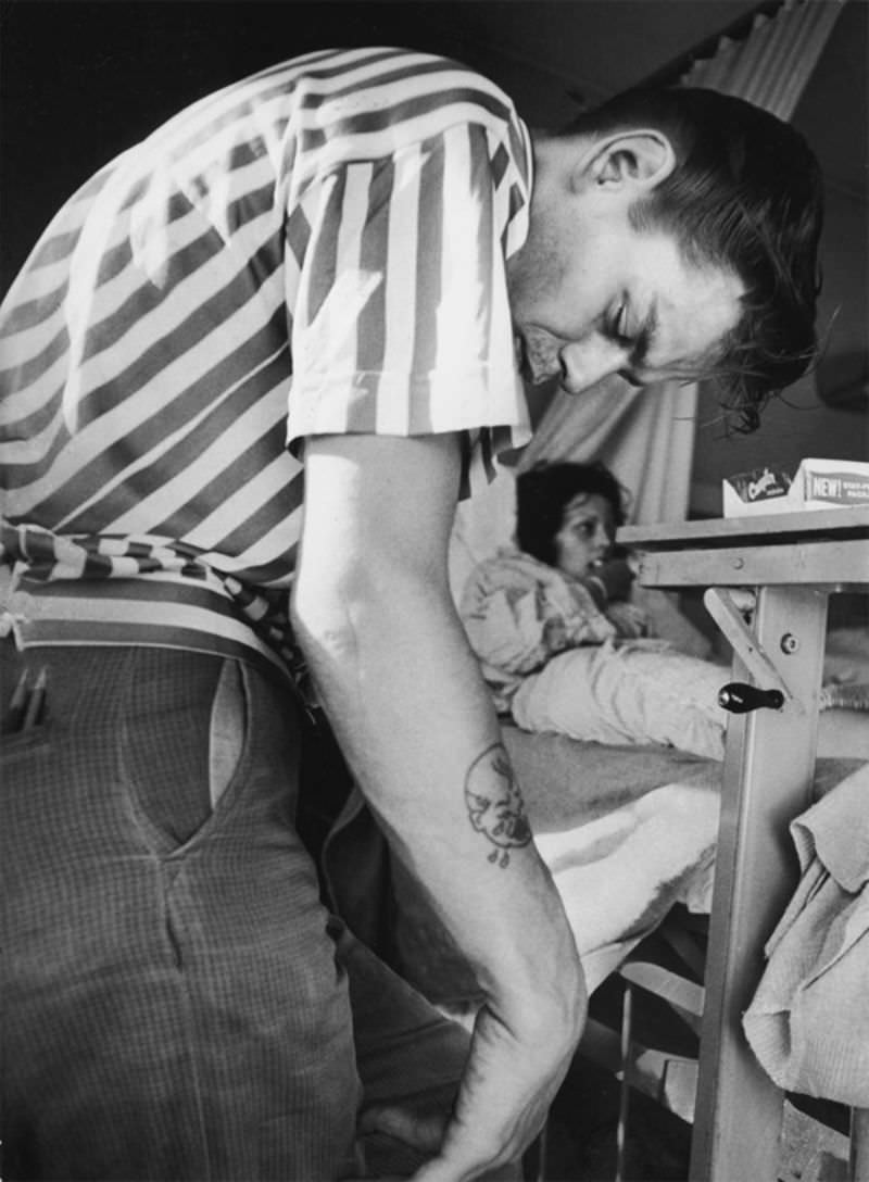 John, a heroin addict, visting his girlfriend Karen, also a heroin user, in the hospital. John is high on heroin.