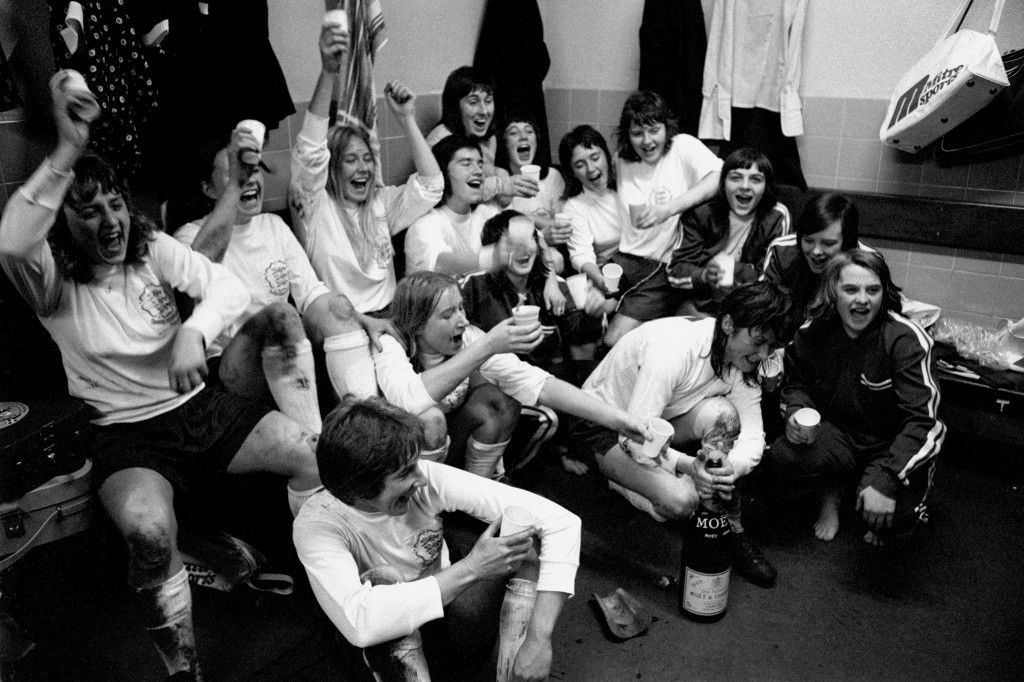 West Ham United players celebrating victory in the dressing room, 1975.