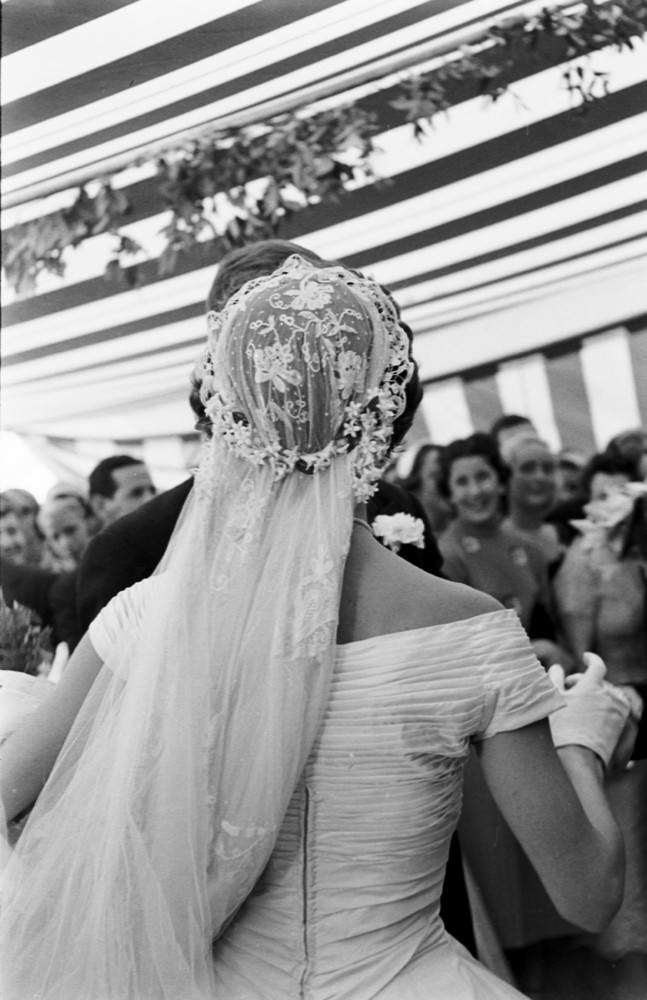 Jacqueline Kennedy dances with her husband, John F. Kennedy, at their wedding reception, Newport, Rhode Island, 1953.