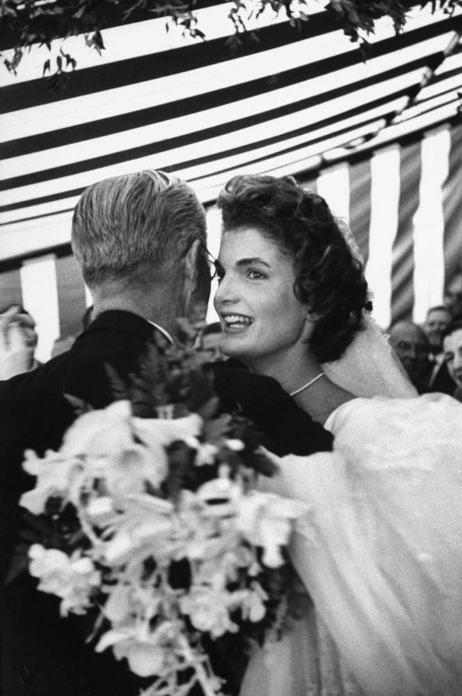 Joseph Kennedy dancing with his son John F. Kennedy's bride, Jacqueline Bouvier Kennedy, at their wedding reception, 1953.