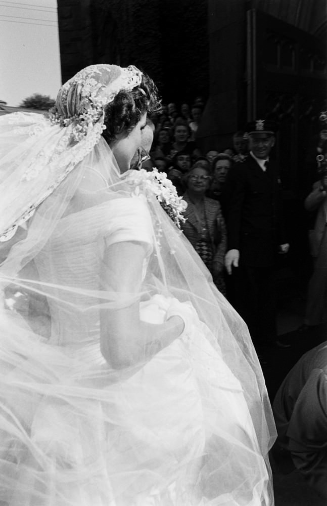 Jacqueline Kennedy arrives at St. Mary's Church for her wedding to John F. Kennedy, Newport, Rhode Island, 1953.