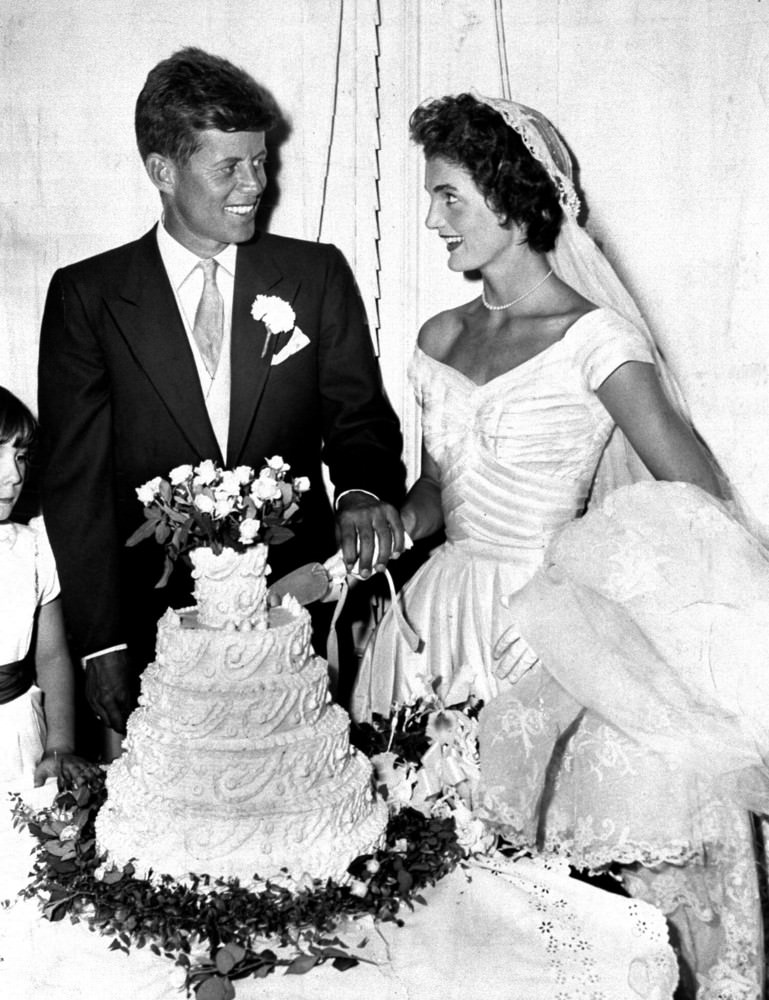 President John F. Kennedy and his wife Jacqueline cut the wedding cake, Newport, Rhode Island, 1953.