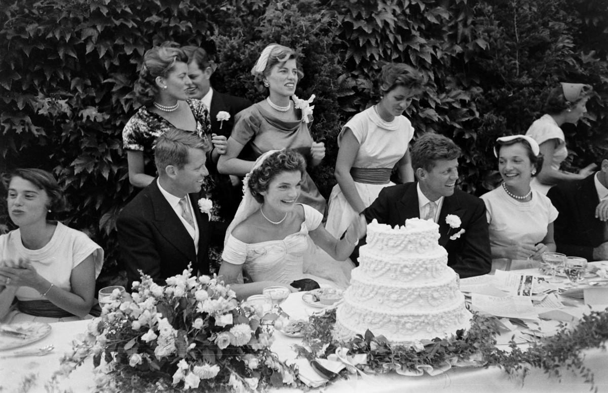 The head table at the Kennedy wedding reception, Newport, Rhode Island, 1953. Robert Kennedy, Jacqueline Kennedy, John F. Kennedy, and Eunice Kennedy Shriver are visible.