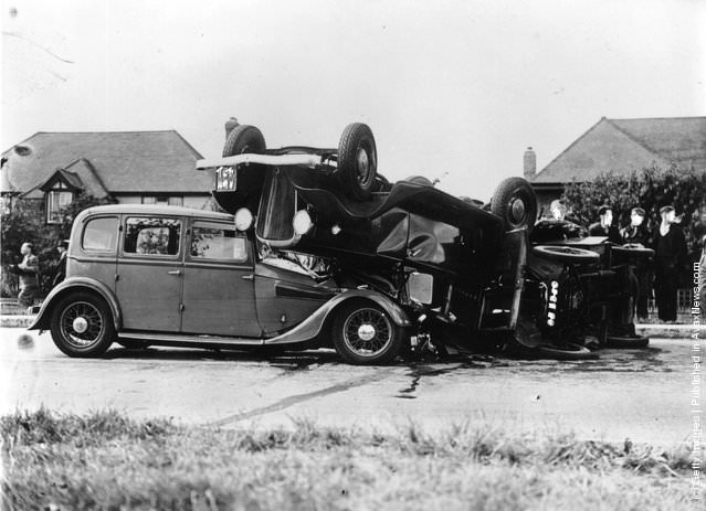 A three-car crash on the Kingston By-Pass, with two cars overturned, 1939.