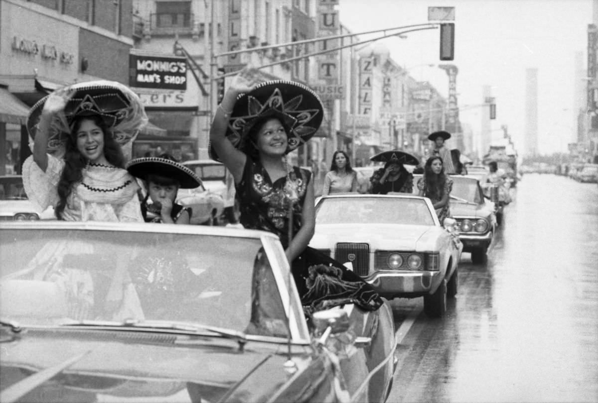 Parade participants wave from a convertible in the Mexican Independence Day parade in Fort Worth, Texas, 1974.