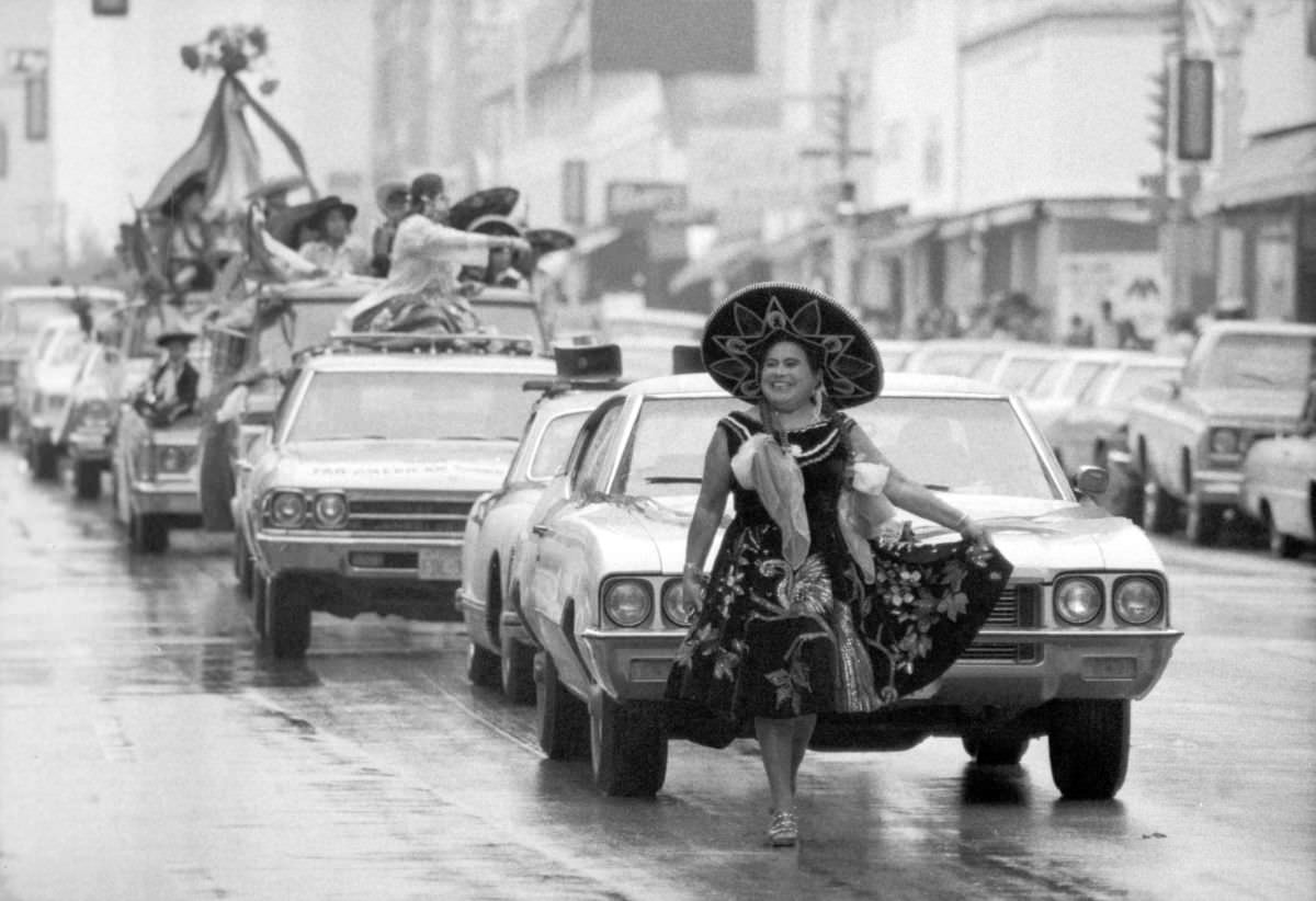 A participant in traditional Mexican attire walks in the Mexican Independence Day parade in Fort Worth, Texas, 1974.