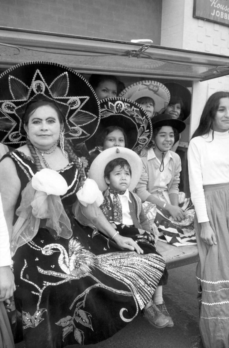 The Cerda family, in traditional Mexican attire, watches the Mexican Independence Day parade in Fort Worth, Texas, 1974.