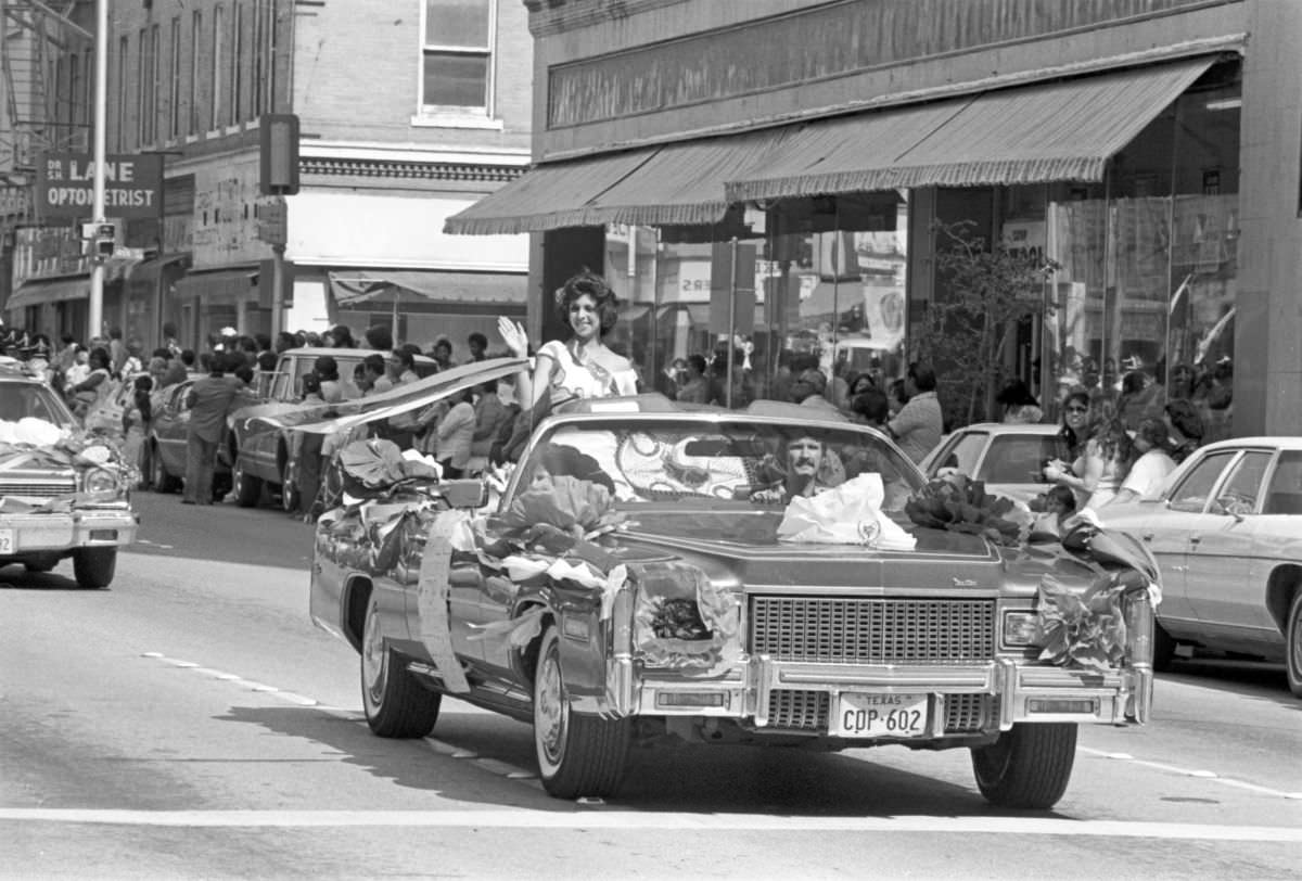 A candidate for the Mexican Independence Day Fiesta Queen waves from a convertible in Fort Worth, Texas, 1977.