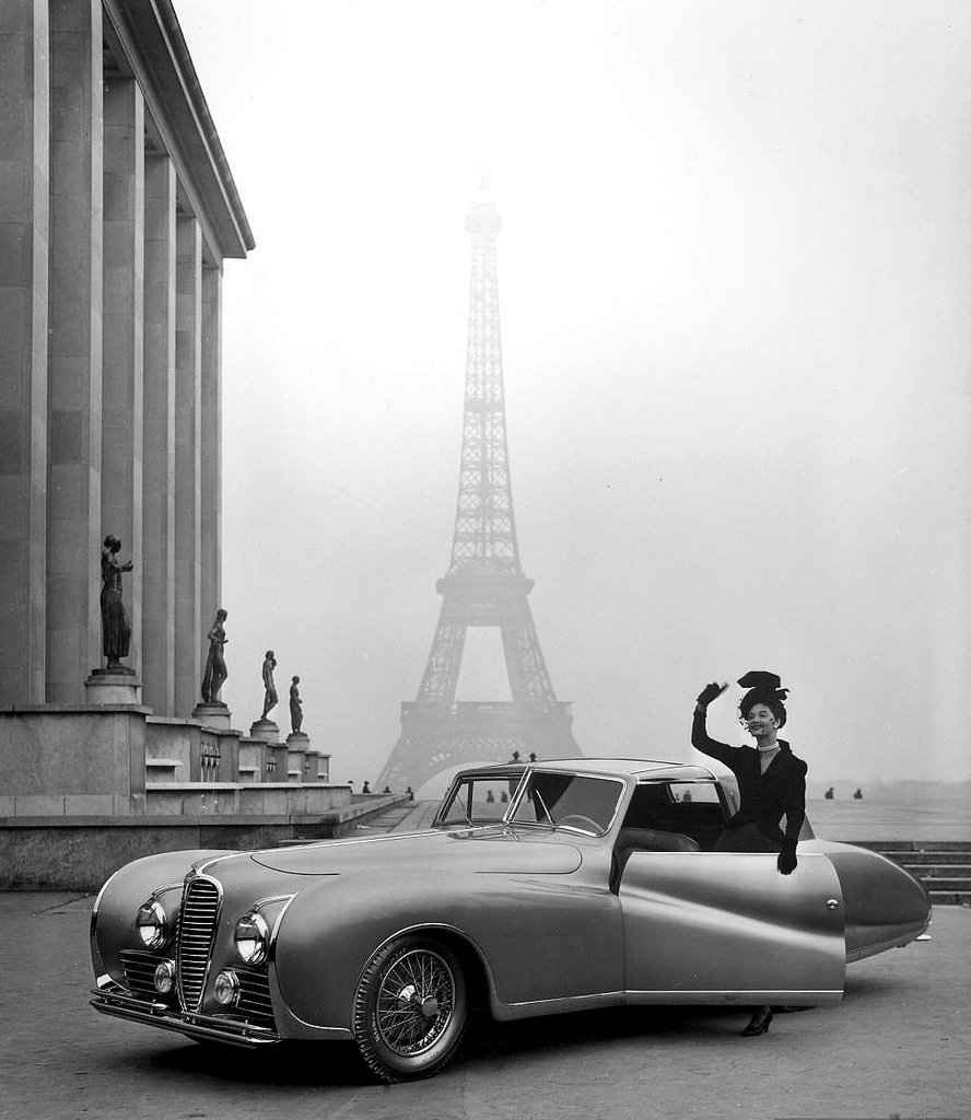 Model and 1947 Delahaye automobile against background of the Eiffel Tower, photo by Tony Linck, 1947