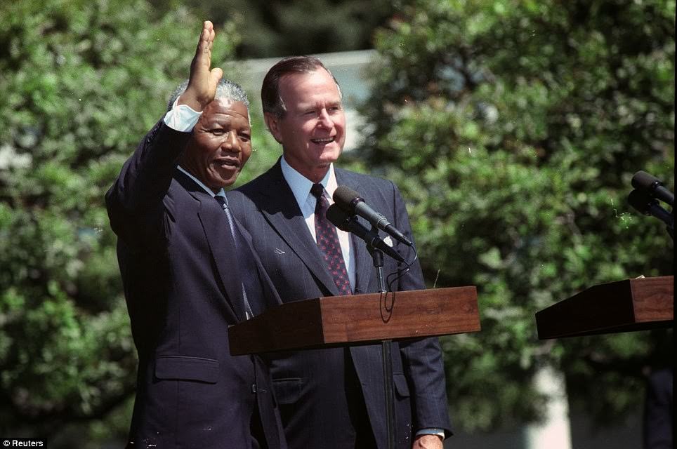 African National Congress leader Nelson Mandela waves after he and U.S. President George Bush made remarks on the South Lawn of the White House June 25, 1990 - the support of the US public was key in securing his release.
