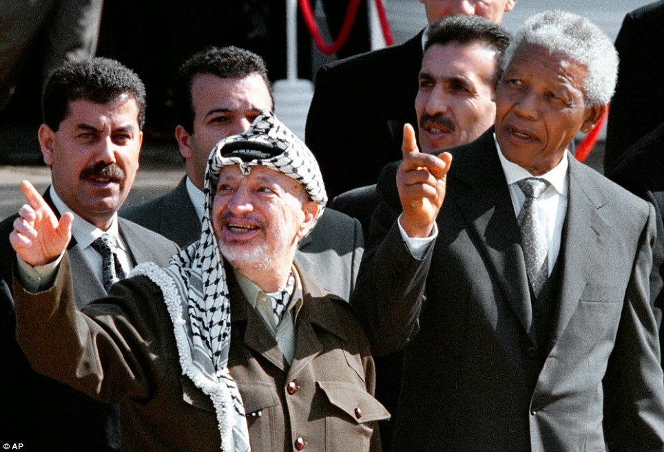 In this Aug. 11, 1998 file photo, South African President Nelson Mandela, (right), and Palestinian leader Yasser Arafat gesture during a meeting in Cape Town, South Africa.