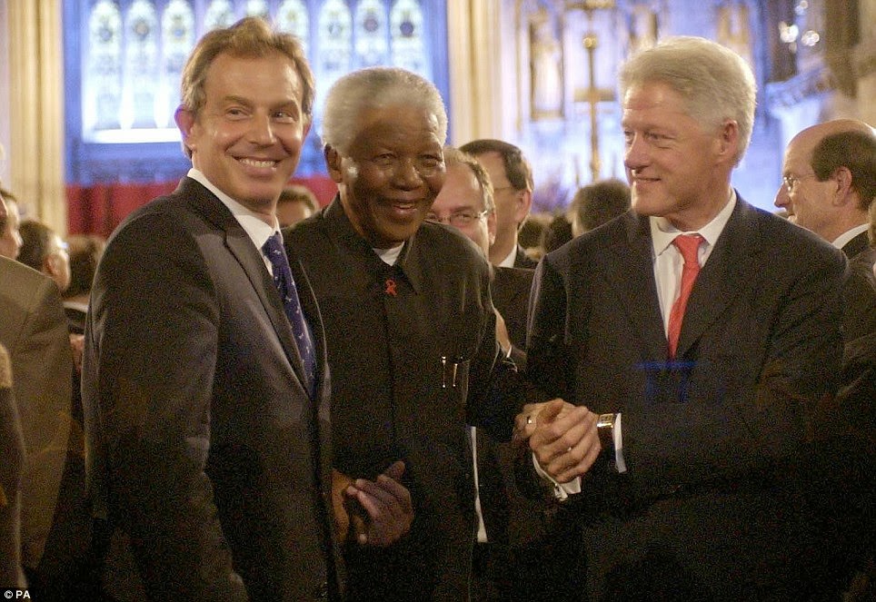 British Prime Minister Tony Blair, former South African President Nelson Mandela and former US President Bill Clinton attending a gala night to mark the centenary of the Rhodes Trust in 2003.