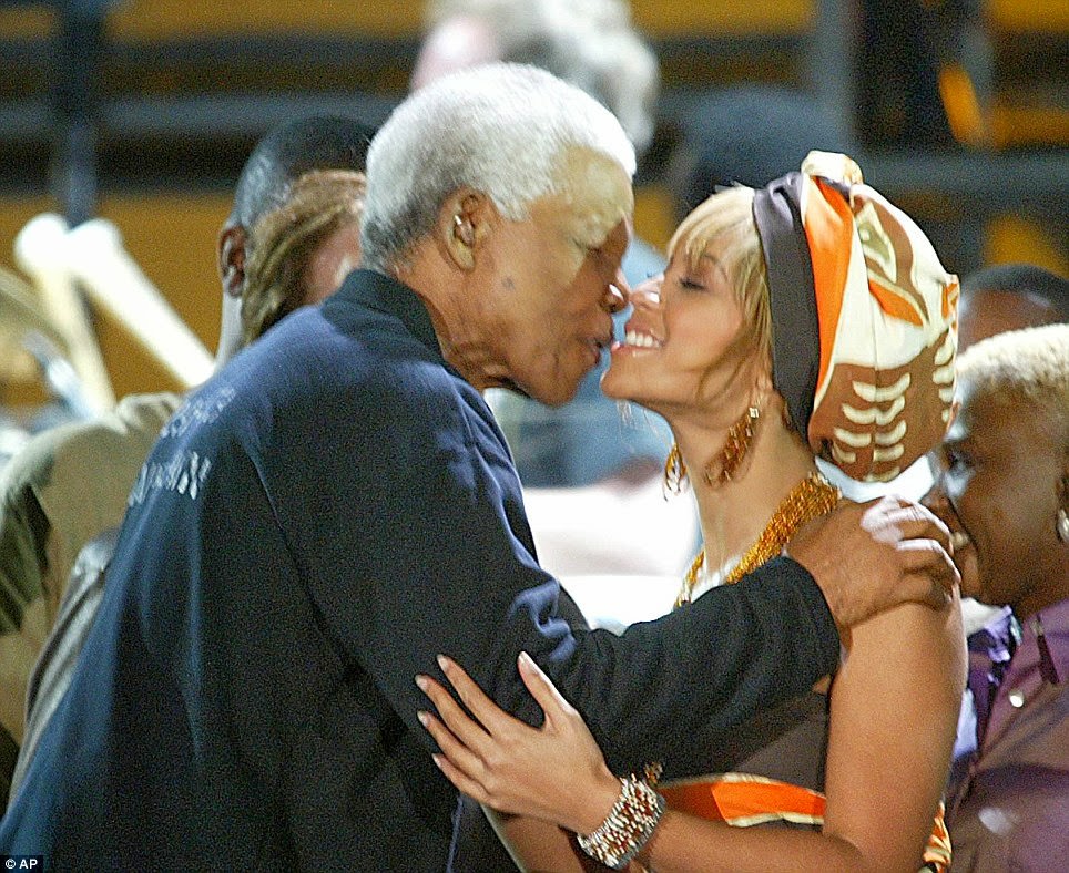Former South African President Nelson Mandela kisses U.S. singer Beyonce Knowles, at the Nelson Mandela AIDS Benefit Concert in Cape Town, South Africa Saturday Nov. 29, 2003.
