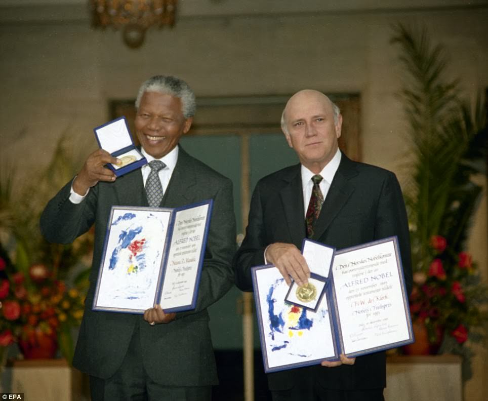 ANC leader, South African Nelson Mandela (L) and South African President, South African, F.W.De Klerk (R) posing for a photograph with medals and diplomas as they share the Nobel Peace Price 1993.