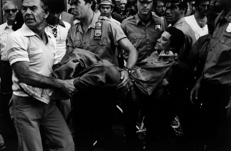 A man carried away in a straitjacket, 1978.