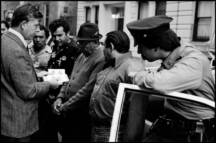 Homicide investigators show photos of suspects to residents, 1972.