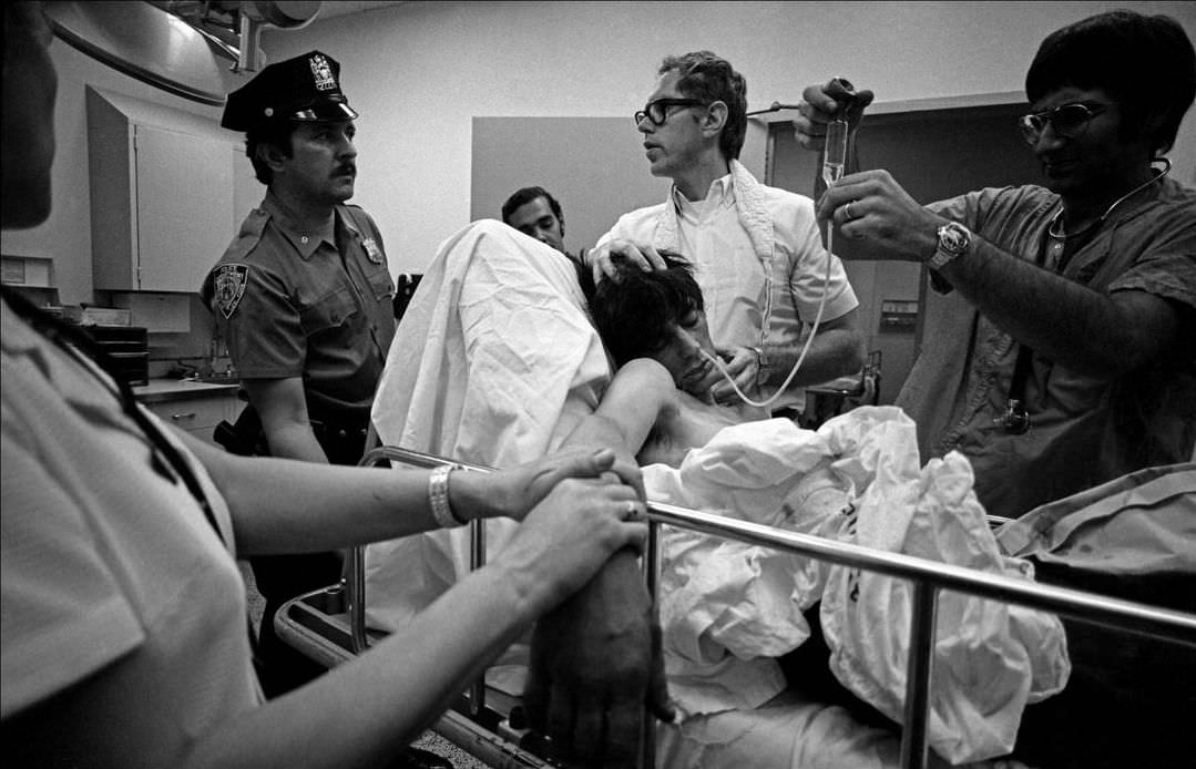 A patient with a drug overdose in the hospital waiting room, 1972.